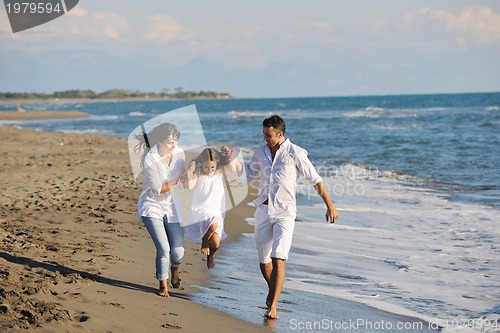Image of happy young  family have fun on beach