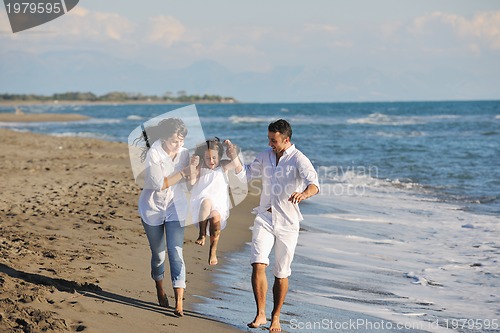 Image of happy young  family have fun on beach