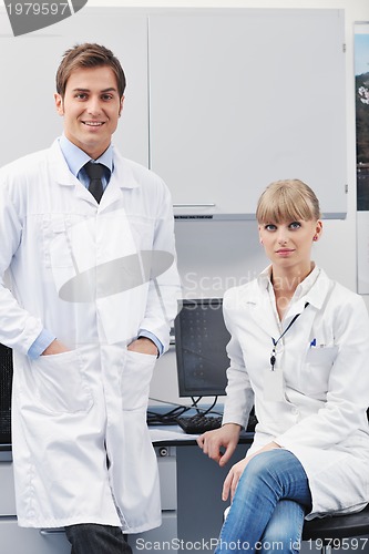 Image of science people in bright lab