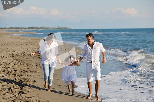 Image of happy young  family have fun on beach