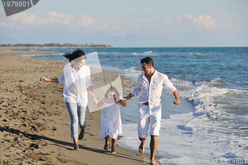 Image of happy young  family have fun on beach