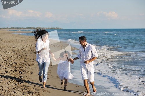 Image of happy young  family have fun on beach