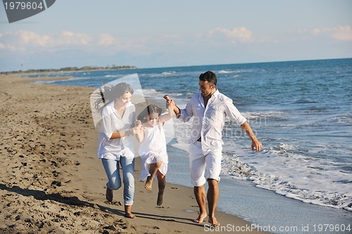 Image of happy young  family have fun on beach