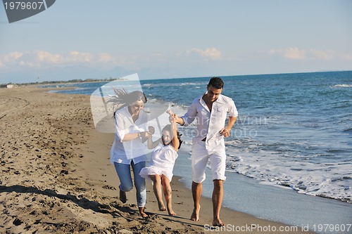 Image of happy young  family have fun on beach