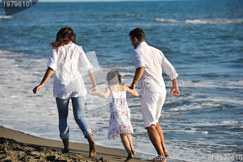 Image of happy young  family have fun on beach