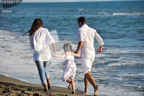 Image of happy young  family have fun on beach