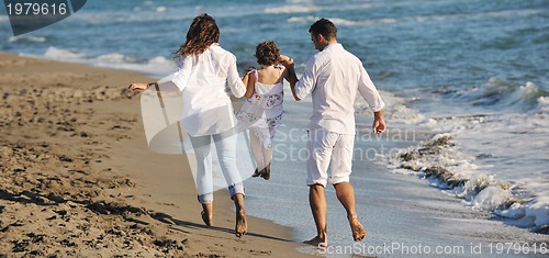 Image of happy young  family have fun on beach