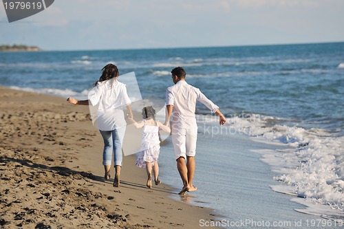 Image of happy young  family have fun on beach