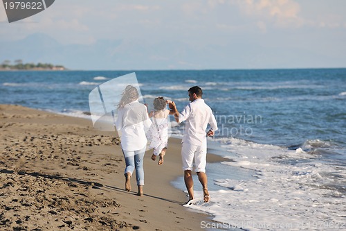 Image of happy young  family have fun on beach