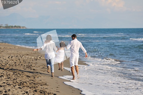 Image of happy young  family have fun on beach