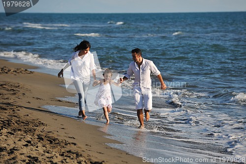 Image of happy young  family have fun on beach