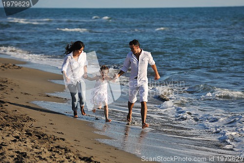 Image of happy young  family have fun on beach
