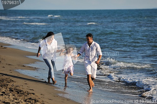 Image of happy young  family have fun on beach