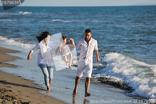Image of happy young  family have fun on beach