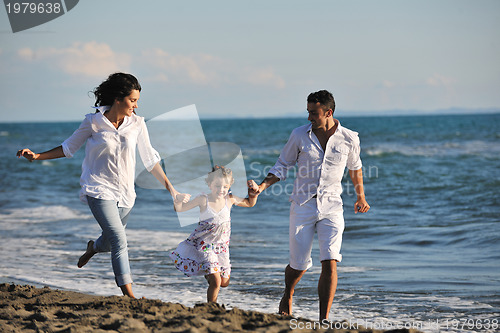Image of happy young  family have fun on beach