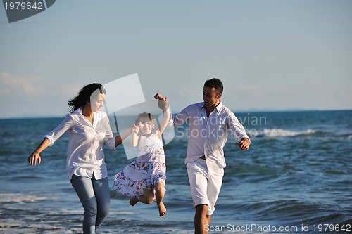 Image of happy young  family have fun on beach