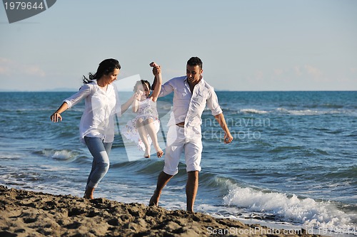 Image of happy young  family have fun on beach