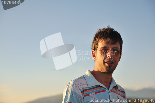 Image of young man at beach