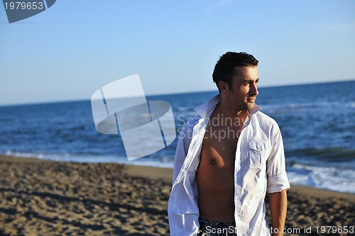 Image of young man at beach