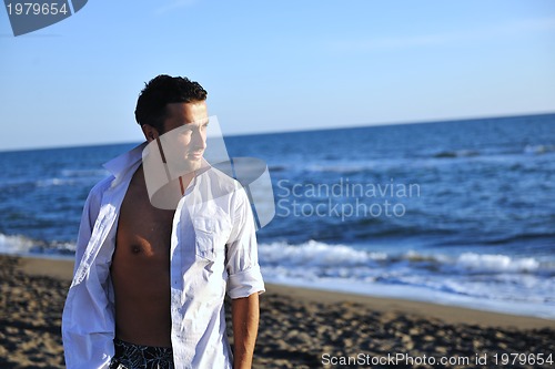 Image of young man at beach