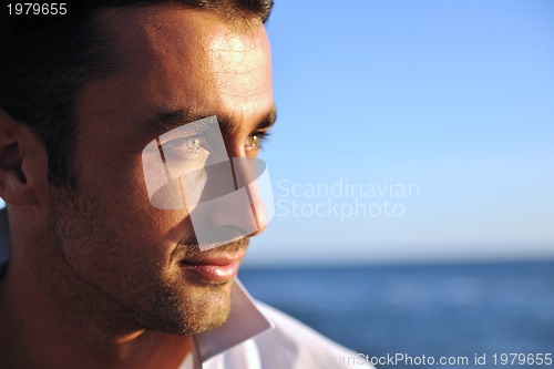 Image of young man at beach