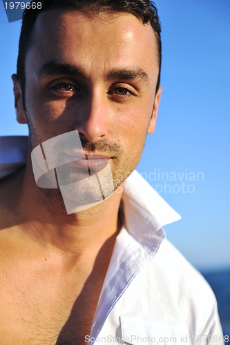 Image of young man at beach