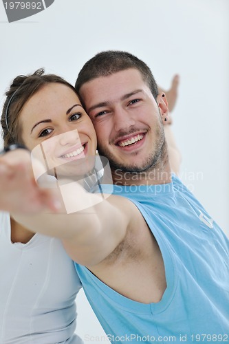 Image of happy young couple fitness workout and fun