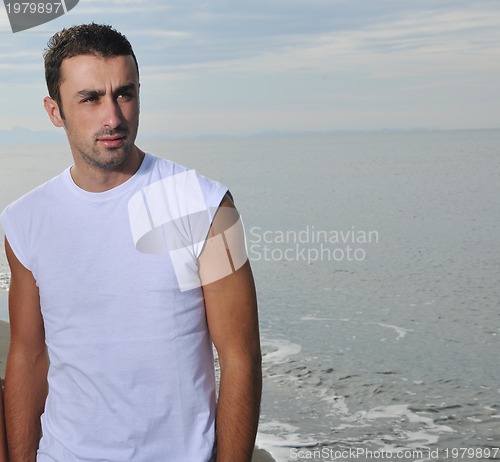 Image of young man at beach