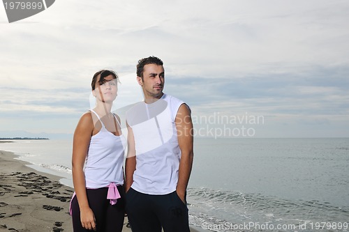 Image of happy young couple have fun at beautiful beach