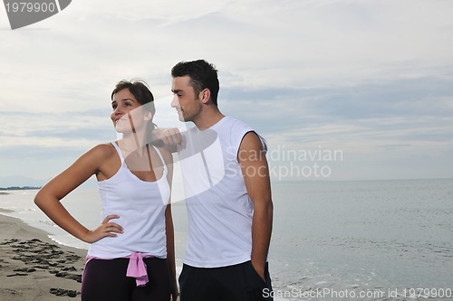 Image of happy young couple have fun at beautiful beach