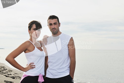 Image of happy young couple have fun at beautiful beach