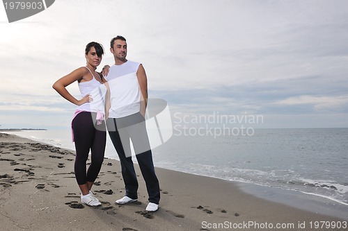 Image of happy young couple have fun at beautiful beach