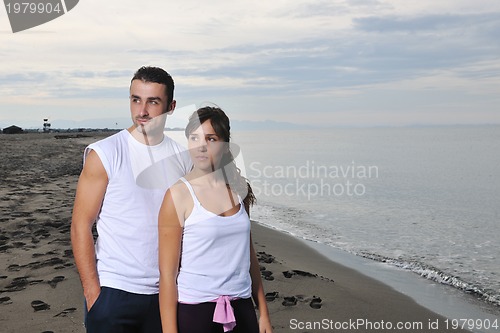 Image of happy young couple have fun at beautiful beach
