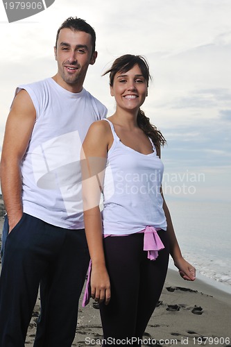 Image of happy young couple have fun at beautiful beach