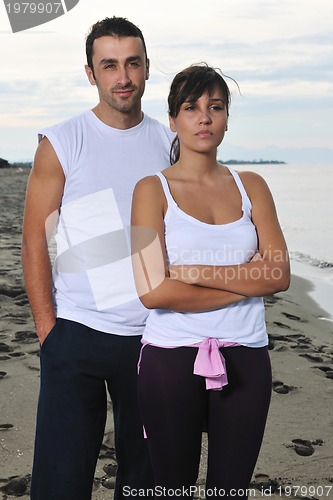 Image of happy young couple have fun at beautiful beach