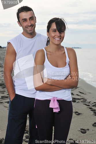 Image of happy young couple have fun at beautiful beach
