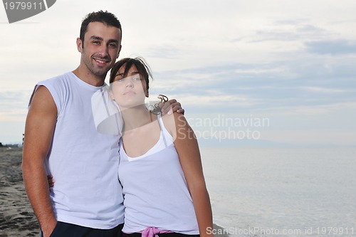 Image of happy young couple have fun at beautiful beach