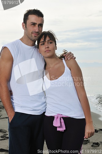 Image of happy young couple have fun at beautiful beach