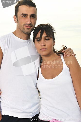 Image of happy young couple have fun at beautiful beach