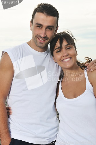 Image of happy young couple have fun at beautiful beach