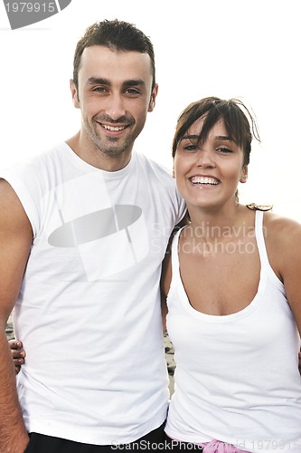 Image of happy young couple have fun at beautiful beach