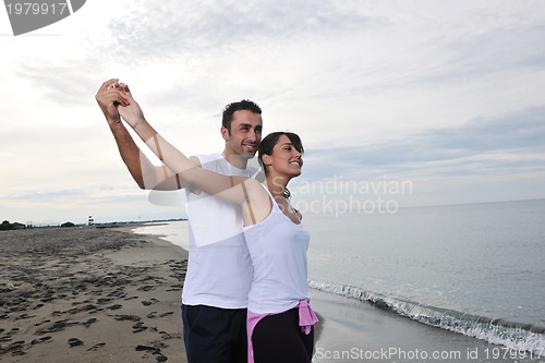 Image of happy young couple have fun at beautiful beach