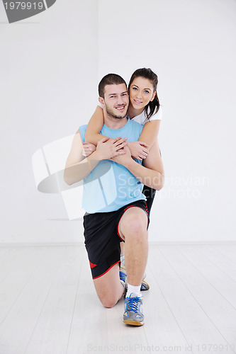 Image of happy young couple fitness workout and fun