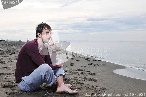 Image of young man at beach