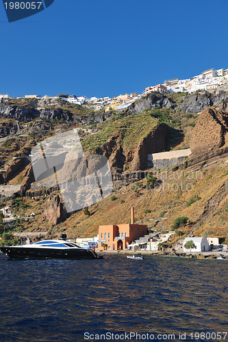 Image of santorini island coast with luxury yacht