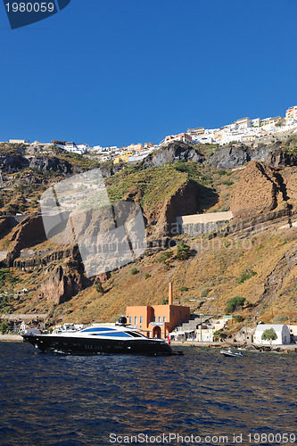 Image of santorini island coast with luxury yacht