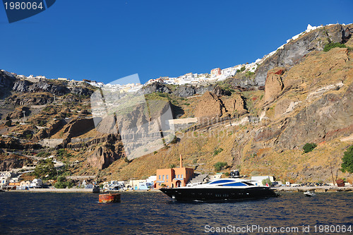 Image of santorini island coast with luxury yacht