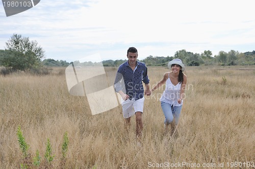 Image of happy young couple have romantic time outdoor
