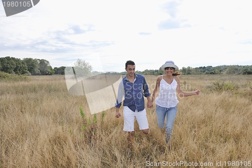 Image of happy young couple have romantic time outdoor