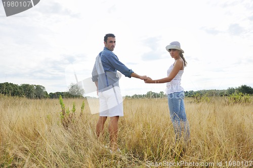 Image of happy young couple have romantic time outdoor